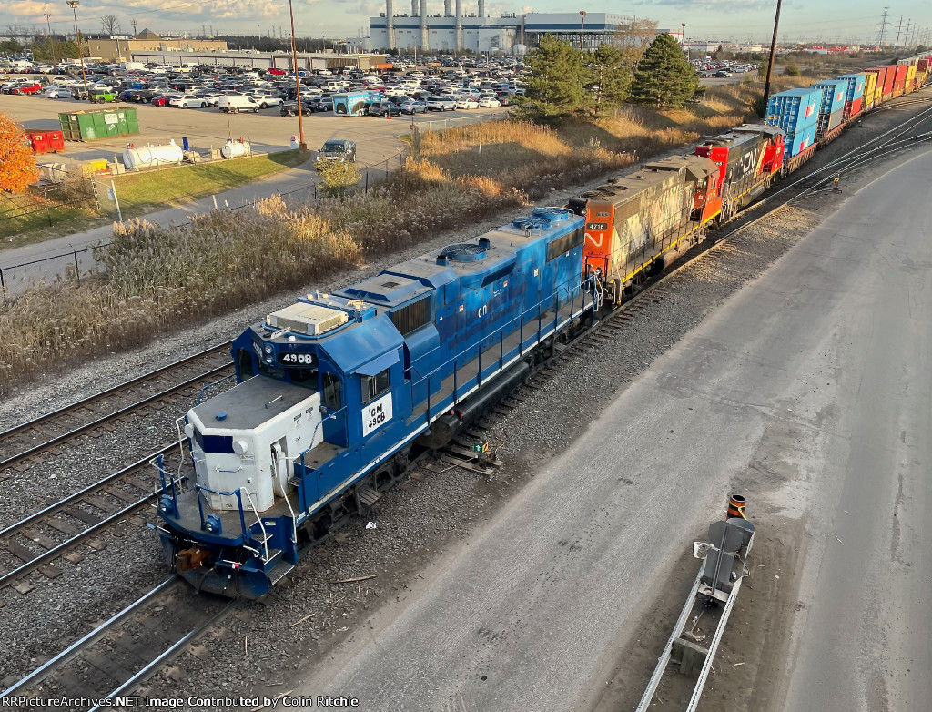 CN 4908/4716/4785 lead a string of double stacks through the Brampton Intermodal Yard. Notice the hand painted signage on the lead CN unit.